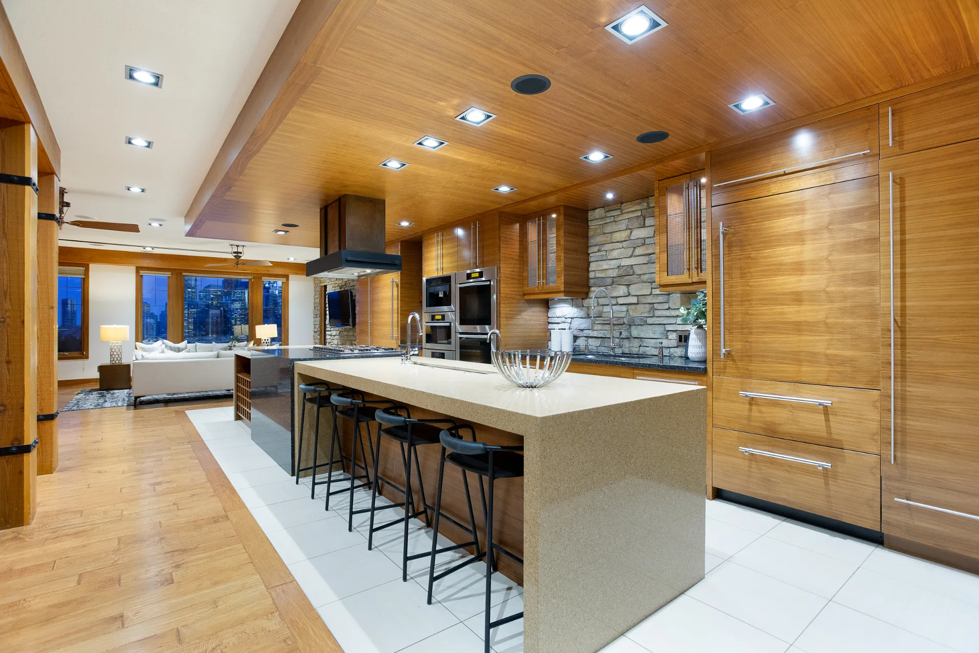 Kitchen with long island, bar seating and cedar ceiling