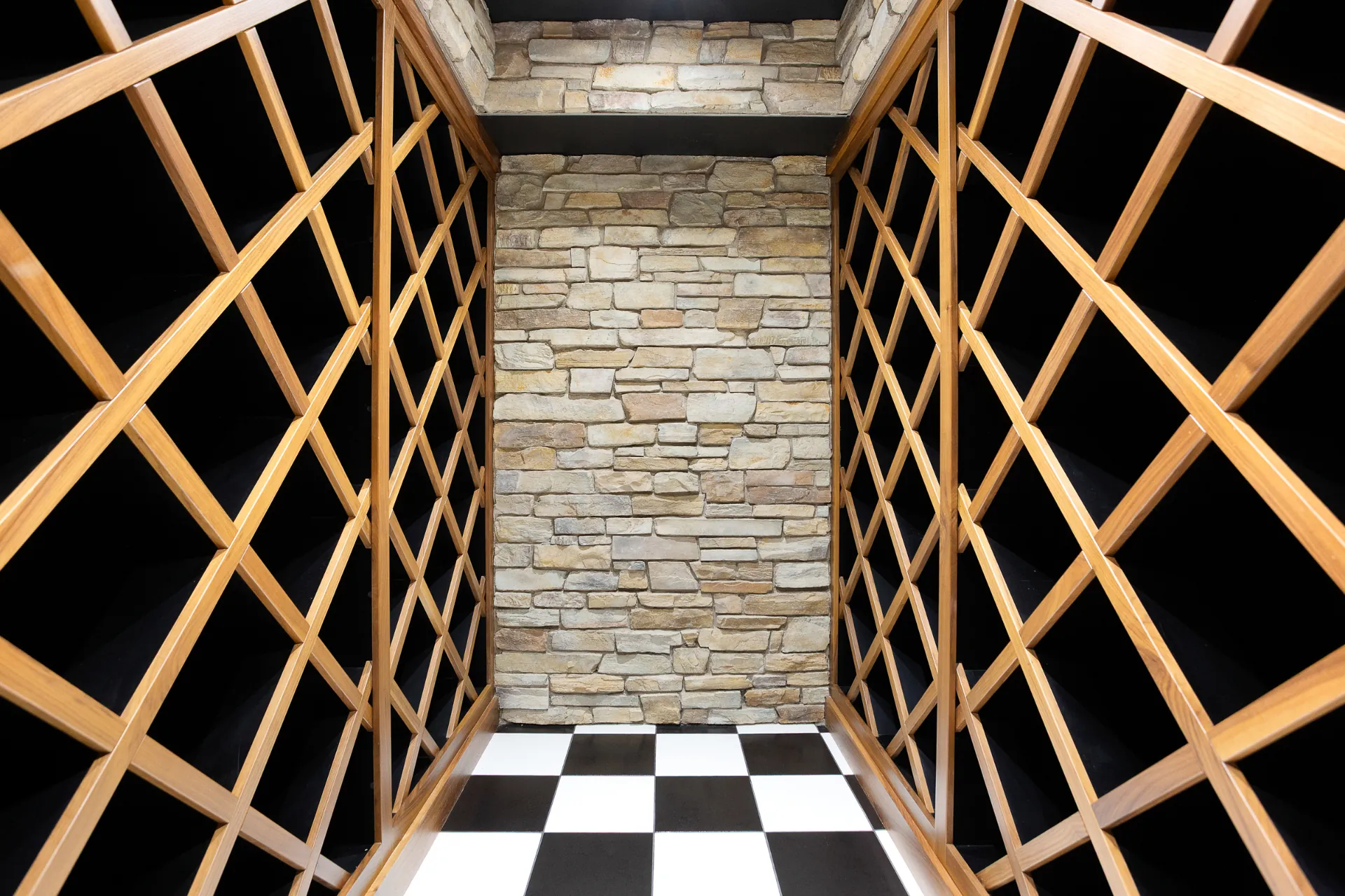 Wine room with timber racks and stone wall