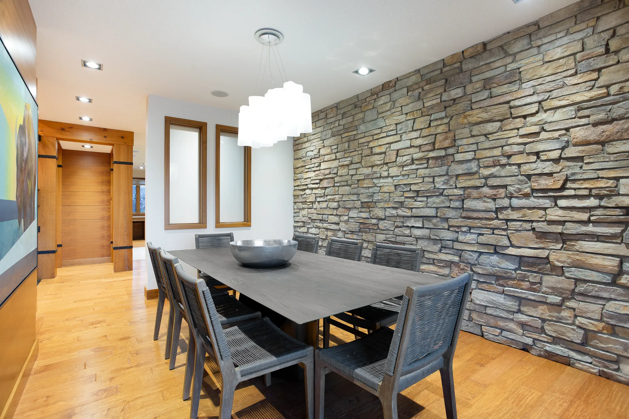 Formal dining room with stone feature wall